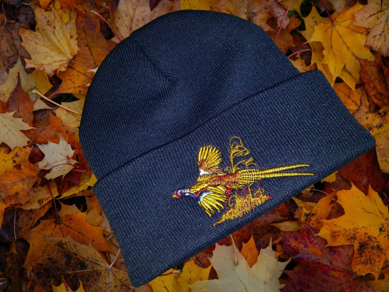 Unisex warm beanie hat with Pheasant embroidered logo.